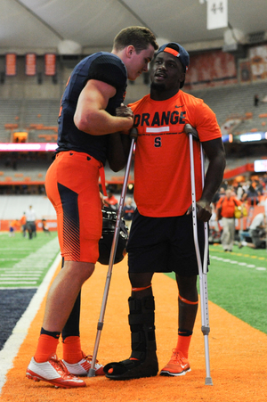 Antwan Cordy, right, used crutches last Friday when he returned to the field after exiting in the first quarter with an injury to his right leg. 